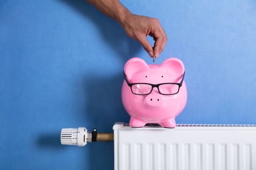 Chauffagiste Valence - Tirelire sur un radiateur.