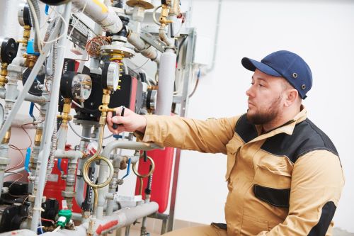 Plombier Capinghem - Un plombier installe un compteur d'eau