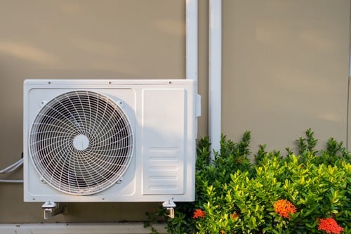 Climatisation Paris 5 - visuel d'un climatiseur à côté d'une plante