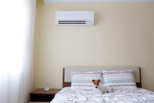 climatisation Bondy - un lit en dessous d'un climatiseur