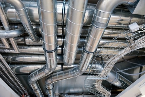 Climatisation Ronchin - visuel de gros tuyaux de climatiseurs au plafond